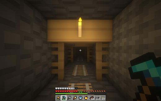 A torch-lit Minecraft mineshaft with rails running into the dark